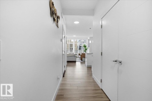 The property features light wood flooring throughout, bright white walls, and recessed lighting - 16624 32 Avenue, Edmonton, AB - Indoor Photo Showing Other Room