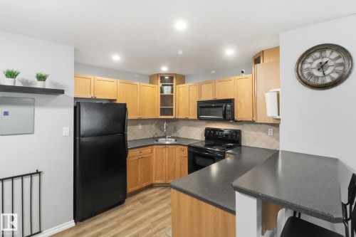 301 8527 82 Avenue, Edmonton, AB - Indoor Photo Showing Kitchen With Double Sink