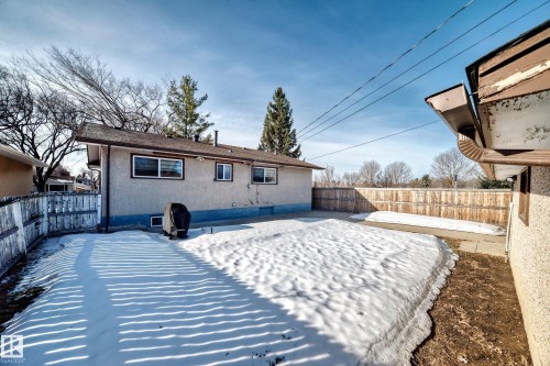 The property features a fenced yard with a concrete patio - 4446 116 Avenue, Edmonton, AB 