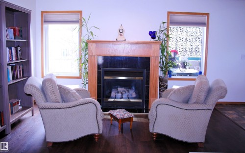 26 Simonette Crescent, Devon, AB - Indoor Photo Showing Living Room With Fireplace