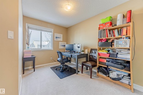 Flex space located on the 2nd level ideal for an office, media area or easily converted to an additional bedroom. - 1312 74 Street, Edmonton, AB - Indoor Photo Showing Office