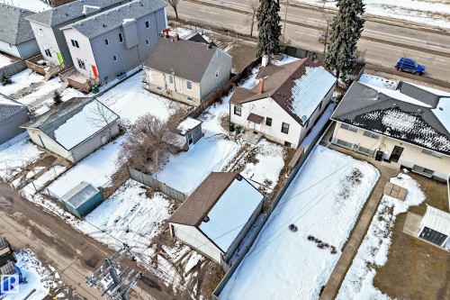 The property features a detached building with a brown roof and a white exterior - 10839 109 Street, Edmonton, AB - Outdoor