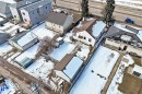 The property features a detached building with a brown roof and a white exterior - 10839 109 Street, Edmonton, AB  - Outdoor 