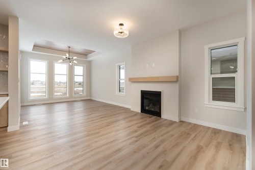 8 Tenuto Link, Spruce Grove, AB - Indoor Photo Showing Living Room With Fireplace