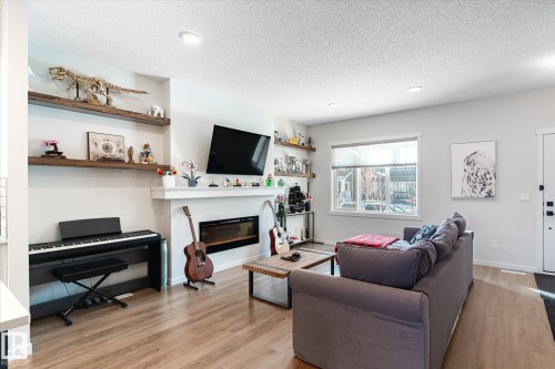 17487 77 Street, Edmonton, AB - Indoor Photo Showing Living Room With Fireplace