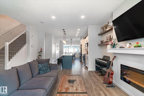 17487 77 Street, Edmonton, AB - Indoor Photo Showing Living Room With Fireplace
