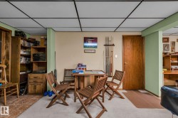 This versatile area features a drop ceiling, light-colored walls, and a combination of carpeted and hard flooring surfaces - 