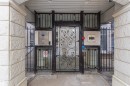 The property features a gated entryway with ornate ironwork and security access panels - 415 10503 98 Avenue, Edmonton, AB  -  With Exterior 