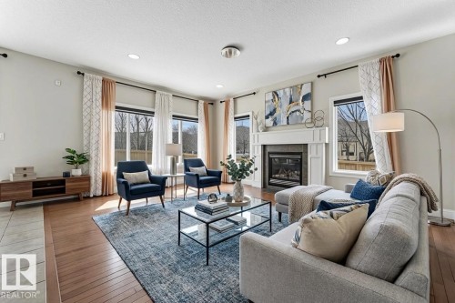 6159 12 Avenue, Edmonton, AB - Indoor Photo Showing Living Room With Fireplace
