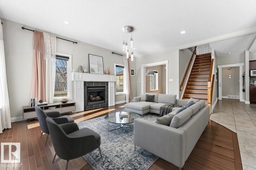 6159 12 Avenue, Edmonton, AB - Indoor Photo Showing Living Room With Fireplace