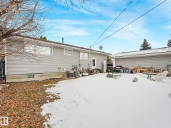 The property features a private yard with a large detached garage - 