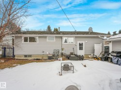 The property features a durable siding exterior, multiple windows providing natural light, and a sloped roof with visible gutters - 
