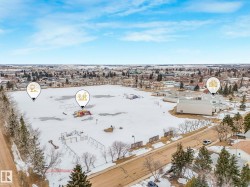 Aerial view showcasing a nearby park with playground equipment and open green spaces - 