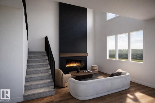 The living room features hardwood flooring, a fireplace with a wood mantel, and large windows providing natural light - 14 Grayson Green, Stony Plain, AB - Indoor Photo Showing Other Room With Fireplace