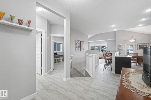 Spacious interior featuring light-colored flooring, recessed lighting, and vaulted ceilings - 8112 Summerside Grande Boulevard, Edmonton, AB - Indoor