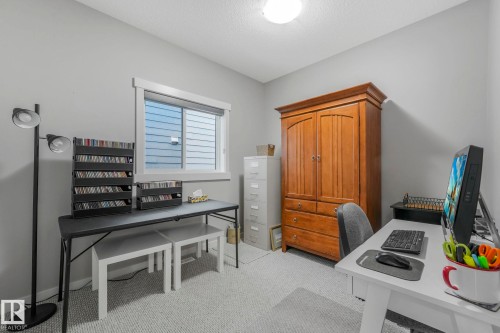 This room features light grey walls and light-colored carpet - 8112 Summerside Grande Boulevard, Edmonton, AB - Indoor Photo Showing Office