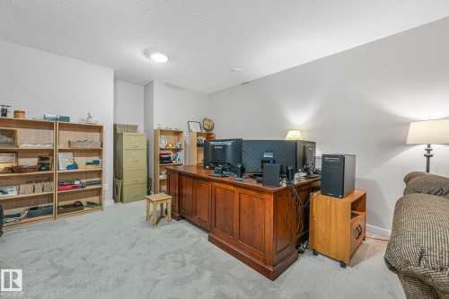 This versatile room features light-colored carpeting, recessed lighting, and ample wall space - 8112 Summerside Grande Boulevard, Edmonton, AB - Indoor Photo Showing Other Room