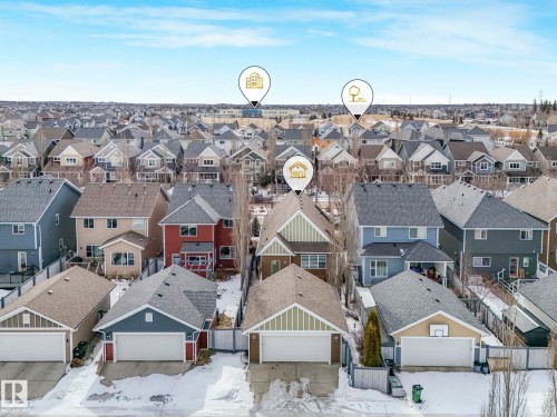 Aerial view of the property and surrounding neighborhood, showcasing a residential area with various homes and a clear blue sky - 8112 Summerside Grande Boulevard, Edmonton, AB - Outdoor With Facade