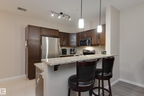 317 6083 Maynard Way, Edmonton, AB - Indoor Photo Showing Kitchen With Upgraded Kitchen