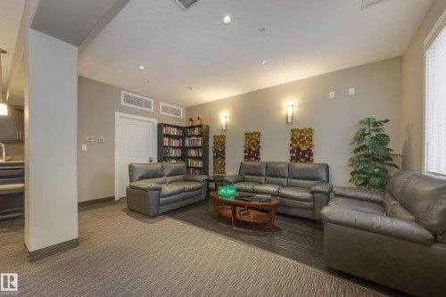 317 6083 Maynard Way, Edmonton, AB - Indoor Photo Showing Living Room