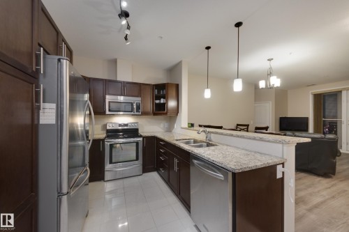 317 6083 Maynard Way, Edmonton, AB - Indoor Photo Showing Kitchen With Double Sink With Upgraded Kitchen