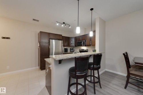 317 6083 Maynard Way, Edmonton, AB - Indoor Photo Showing Kitchen With Upgraded Kitchen