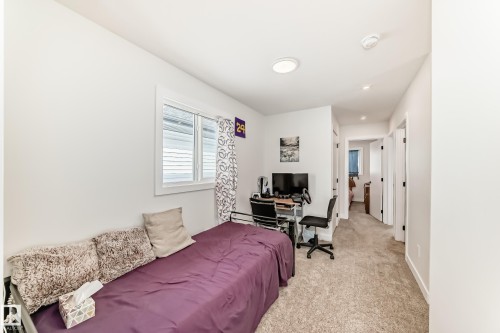 Located at the top of the stairs. Bonus area for any family need. - 12435 47 Street Nw, Edmonton, AB - Indoor Photo Showing Bedroom