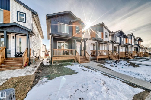 Community on this street is new and construction continues. - 12435 47 Street Nw, Edmonton, AB - Outdoor With Deck Patio Veranda