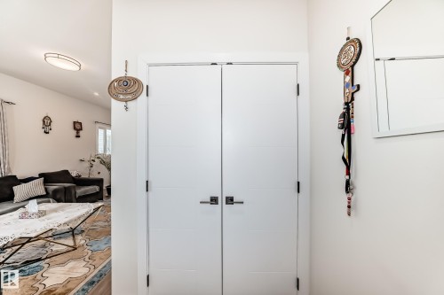 Entry closet for family and guests. - 12435 47 Street Nw, Edmonton, AB - Indoor Photo Showing Other Room