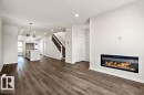 231 Wattle Road, Leduc, AB  - Indoor Photo Showing Living Room With Fireplace 