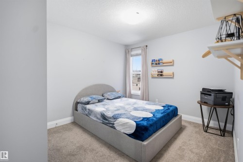 This room features light grey walls and light colored carpeting - 8424 Cushing Court, Edmonton, AB - Indoor Photo Showing Bedroom