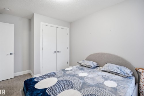 This room features light gray walls, a carpeted floor, and a white ceiling - 8424 Cushing Court, Edmonton, AB - Indoor Photo Showing Bedroom