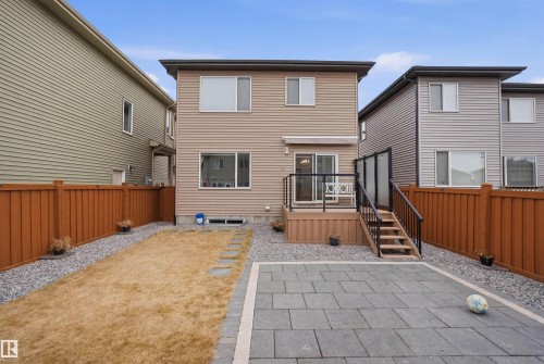 The property features a fenced yard with a combination of gravel and paved sections, and a lawn area - 8424 Cushing Court, Edmonton, AB - Outdoor With Deck Patio Veranda With Exterior