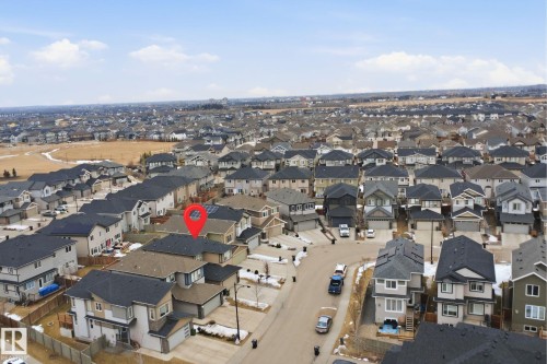 Aerial view highlighting the property with a dark grey roof and an attached garage - 8424 Cushing Court, Edmonton, AB - Outdoor With View