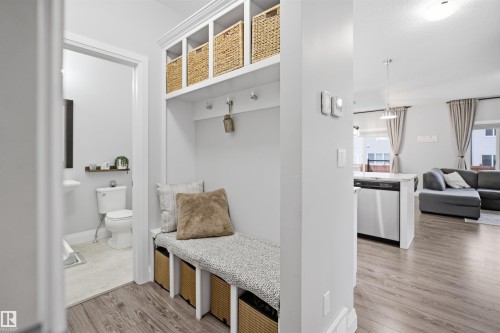 The property features a built-in entryway bench with storage cubbies and overhead shelving - 8424 Cushing Court, Edmonton, AB - Indoor