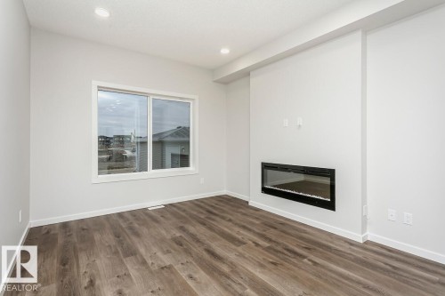 57 Gambel Loop, Spruce Grove, AB - Indoor Photo Showing Living Room With Fireplace