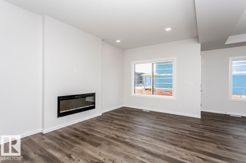 7624 Kimiwan Crescent, Edmonton, AB - Indoor Photo Showing Living Room With Fireplace