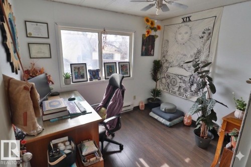 This room features hardwood flooring, a ceiling fan, and a window providing natural light - 11 Willow Park Estates, Leduc, AB - Indoor Photo Showing Office