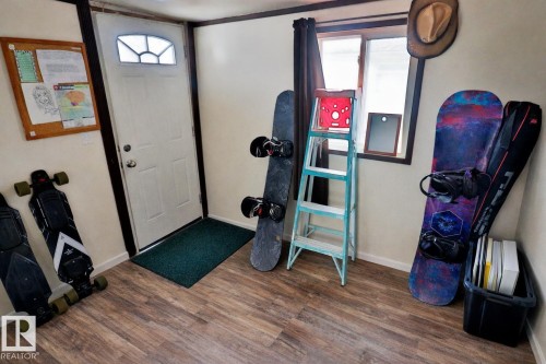 Entryway featuring wood-look flooring and a window providing natural light - 11 Willow Park Estates, Leduc, AB - Indoor Photo Showing Gym Room