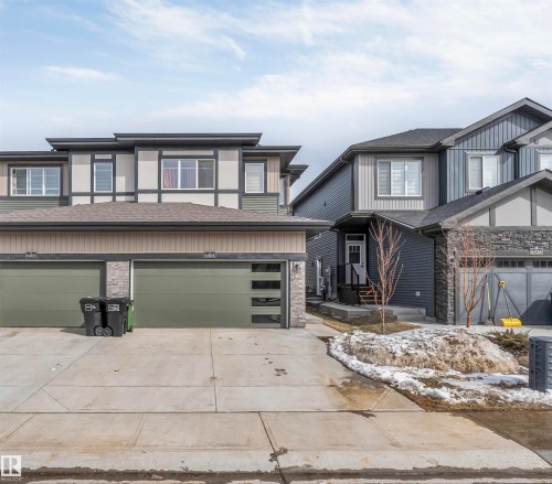 The property features a modern exterior with varied siding textures and a two-car garage - 6404 27 Avenue, Edmonton, AB - Outdoor With Facade