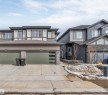 The property features a modern exterior with varied siding textures and a two-car garage - 6404 27 Avenue, Edmonton, AB  - Outdoor With Facade 