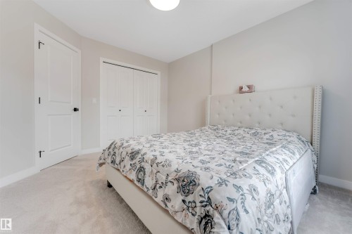 This room features light-colored walls and soft carpeting - 6404 27 Avenue, Edmonton, AB - Indoor Photo Showing Bedroom