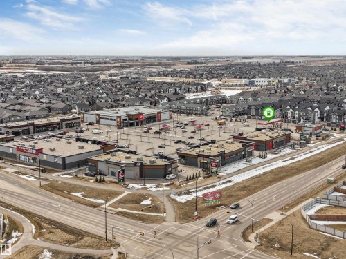 Aerial view showcasing the surrounding commercial amenities and residential properties - 6404 27 Avenue, Edmonton, AB - Outdoor With View