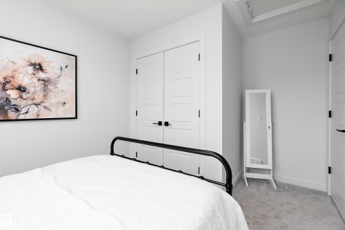 This room features light gray walls, white trim, and light gray carpeting - 20 Hemingway Crescent, Spruce Grove, AB - Indoor Photo Showing Bedroom