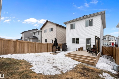 The property features a private yard with a wooden fence and a wooden deck - 20 Hemingway Crescent, Spruce Grove, AB - Outdoor With Deck Patio Veranda With Exterior