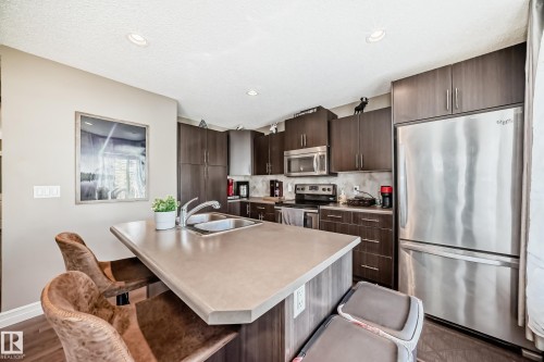 63 3625 144 Avenue Nw, Edmonton, AB - Indoor Photo Showing Kitchen With Stainless Steel Kitchen With Double Sink