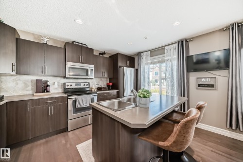 63 3625 144 Avenue Nw, Edmonton, AB - Indoor Photo Showing Kitchen With Stainless Steel Kitchen With Double Sink With Upgraded Kitchen