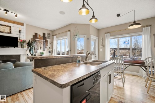 114 Mclaughlin Drive, Spruce Grove, AB - Indoor Photo Showing Kitchen With Fireplace With Double Sink