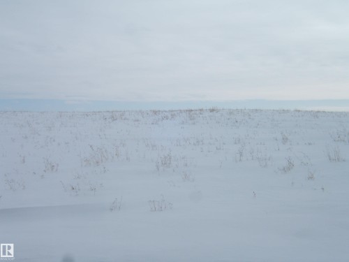 The property features expansive, snow-covered grounds with visible dry vegetation - Se 6-55-12 W 4Th, Rural Two Hills County, AB 