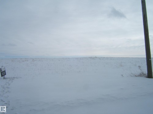 The property features an expansive, snow-covered landscape - Se 6-55-12 W 4Th, Rural Two Hills County, AB 